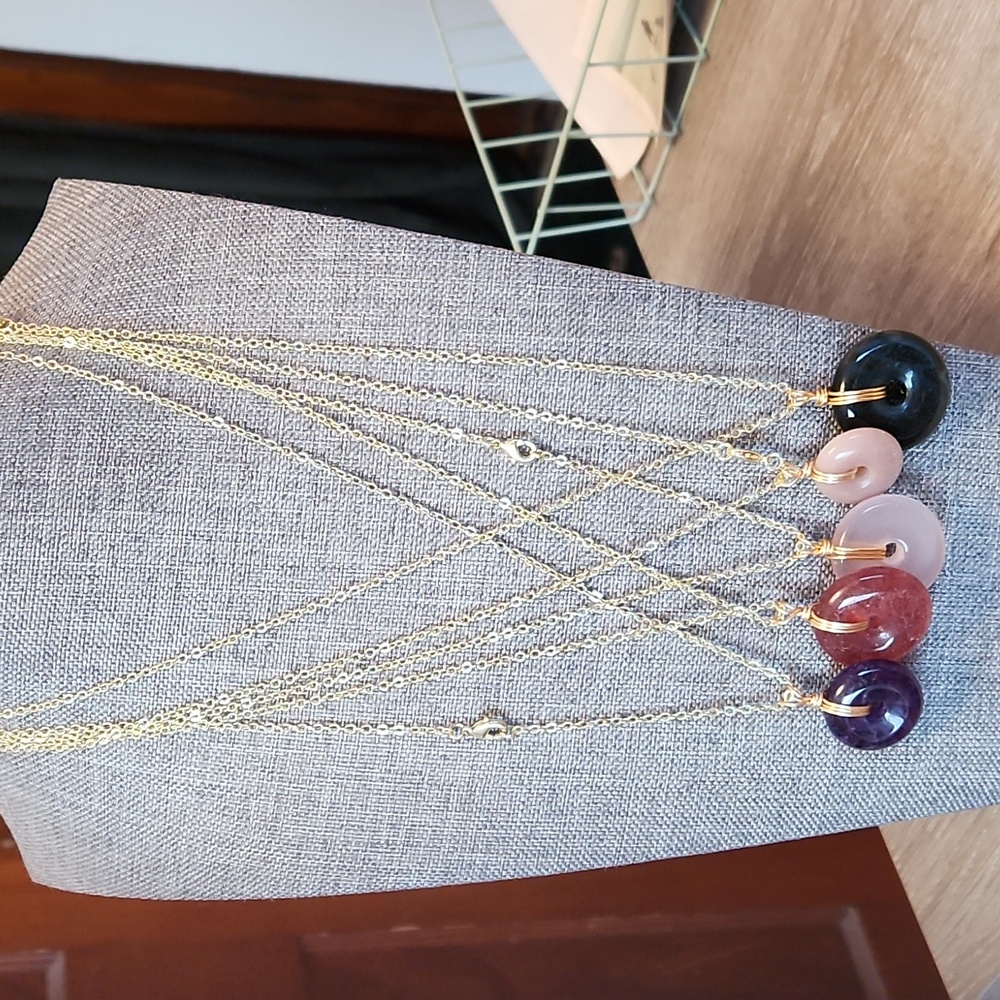 Crystal donut 18 inch necklaces w golden chain.Each sold separately